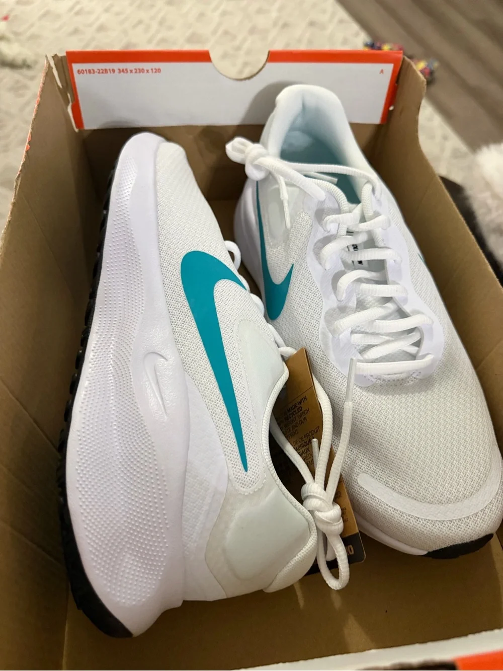 Nike Women’s White Running Sneakers with Teal Swoosh